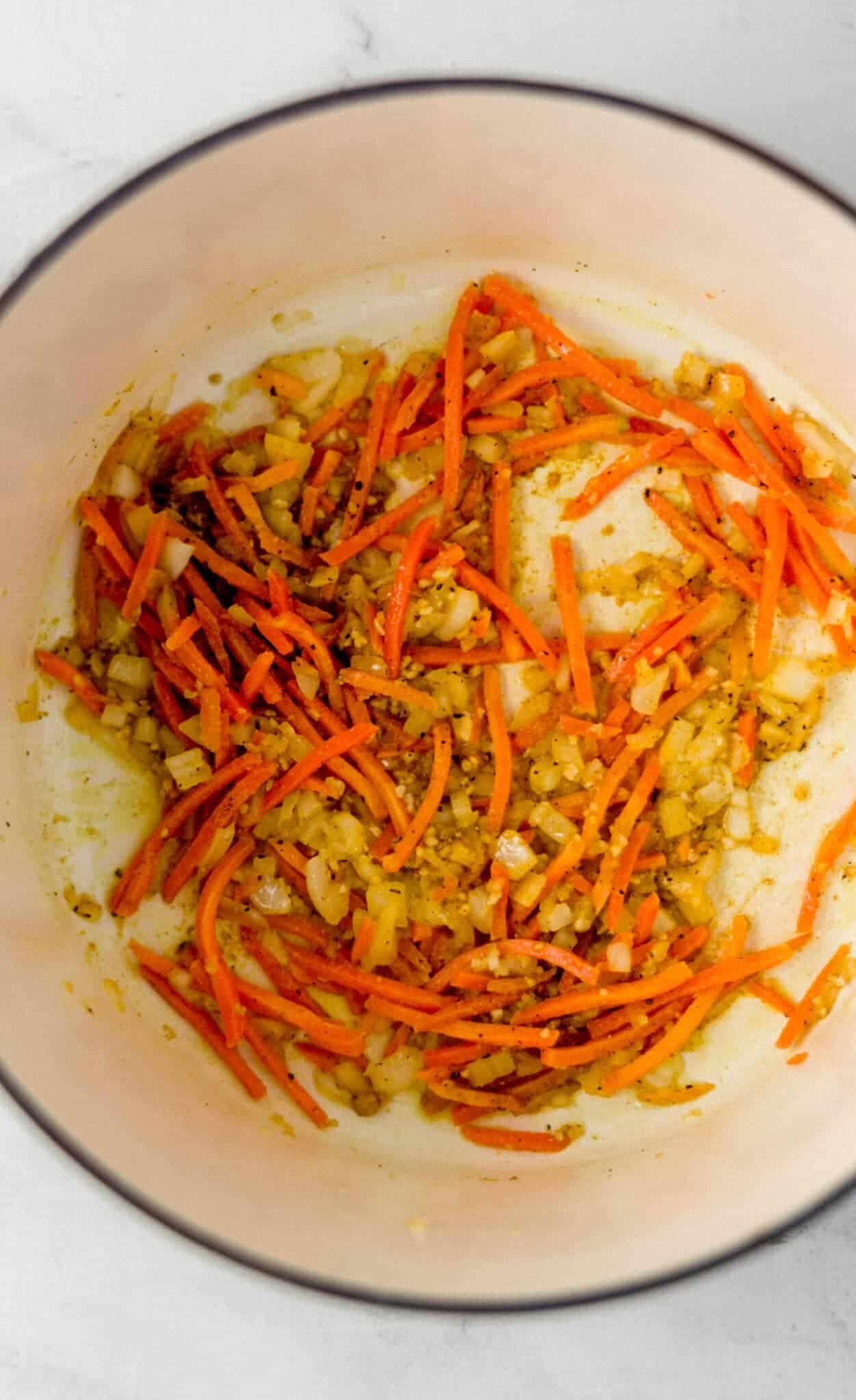 carrot, onion, garlic, and spiced combined in large pot 