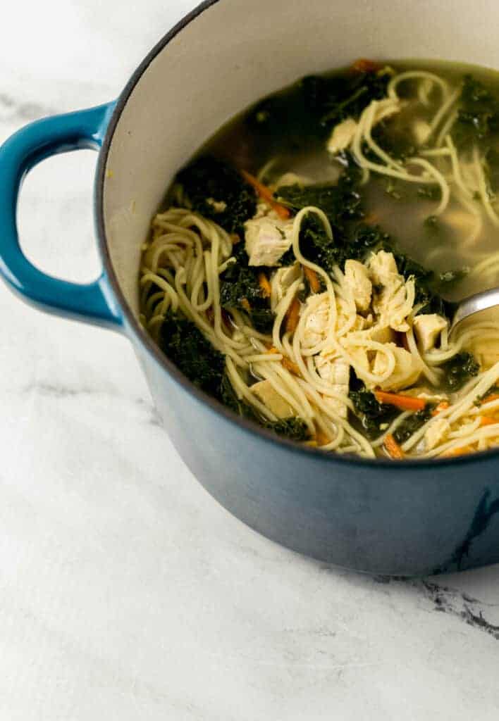 close up side view of finished soup in stockpot