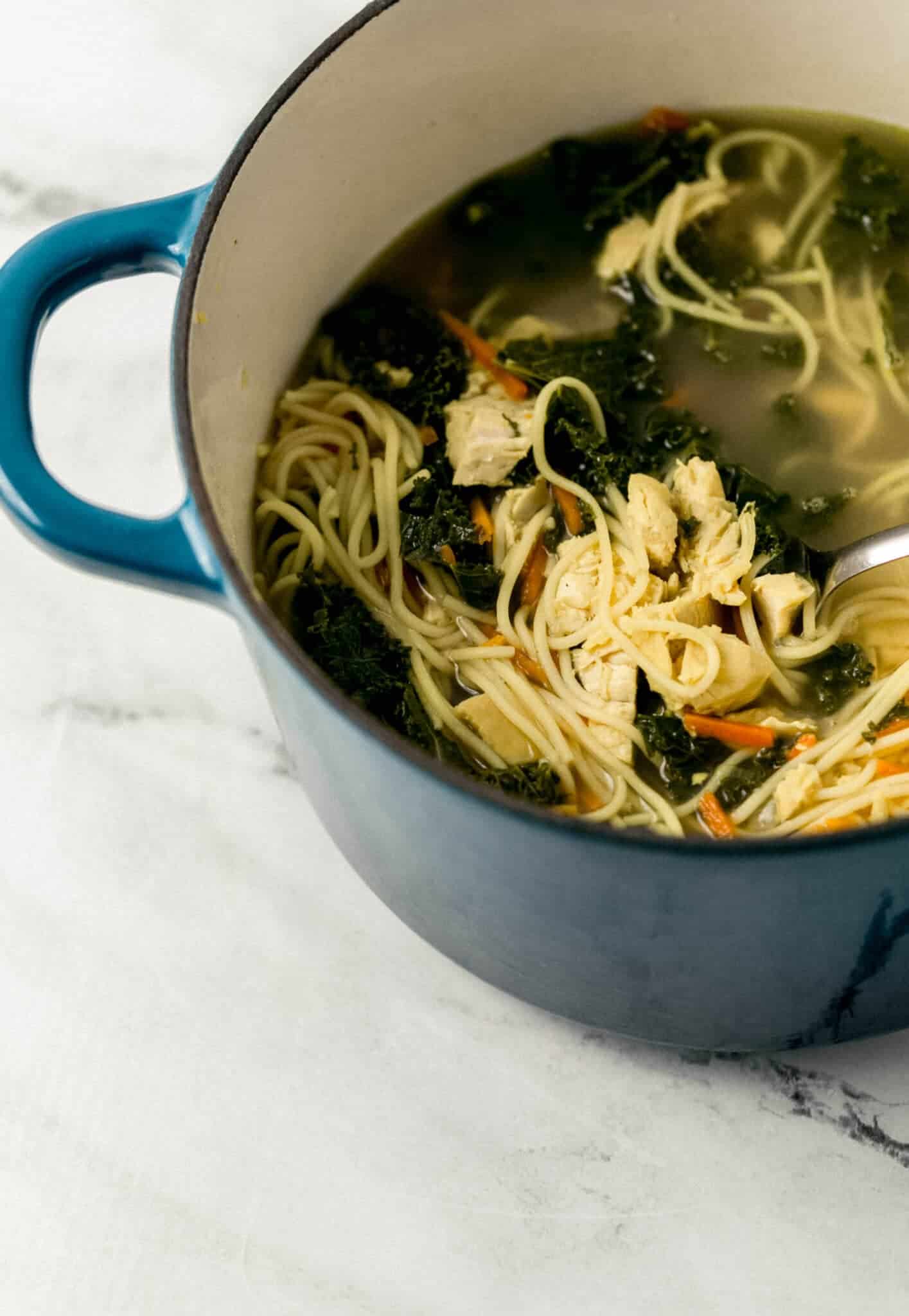 close up side view of finished soup in stockpot 