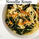 Close up white bowl of soup on marble surface on pin with text overlay.