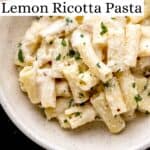Overhead view of pasta in white bowl pin with text overlay.