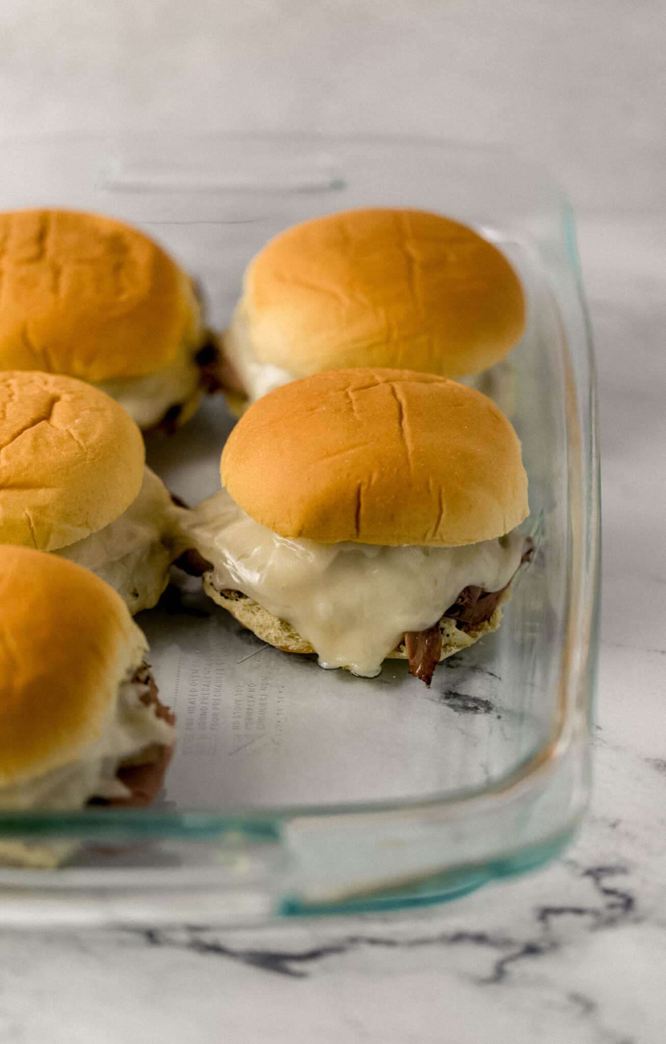 finished sandwiches in glass baking dish 