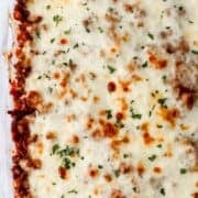 Overhead view of spaghetti in baking dish on pin with text overlay.