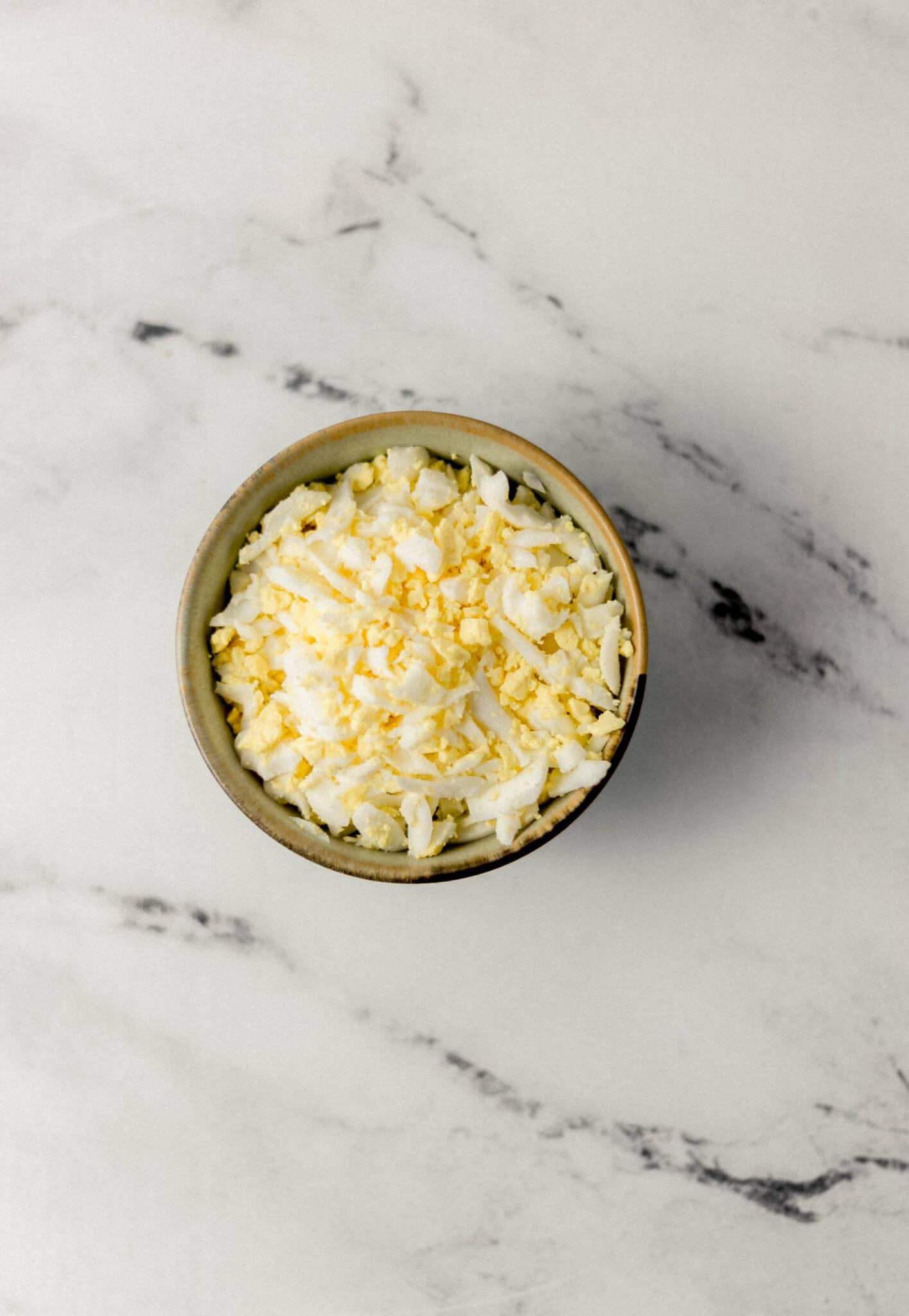 grated eggs in a bowl 