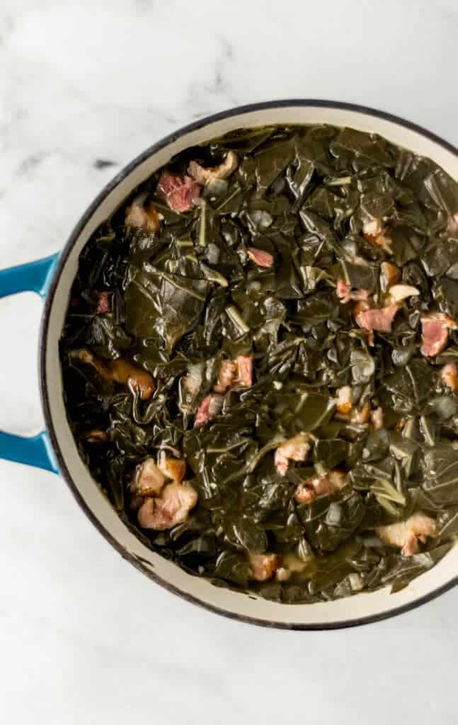 overhead view of finished collards in a large stockpot