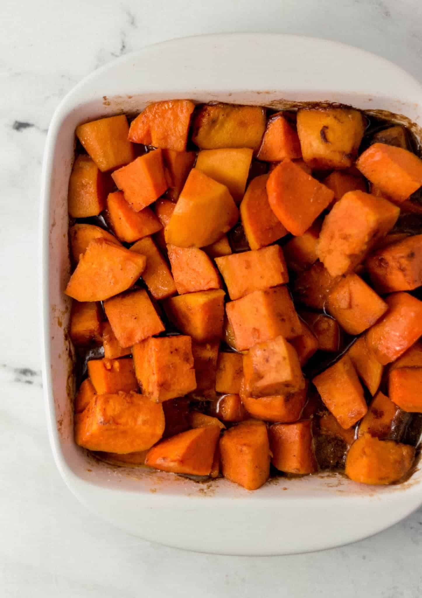 overhead view of candied yams after baking in the oven for ten minutes.