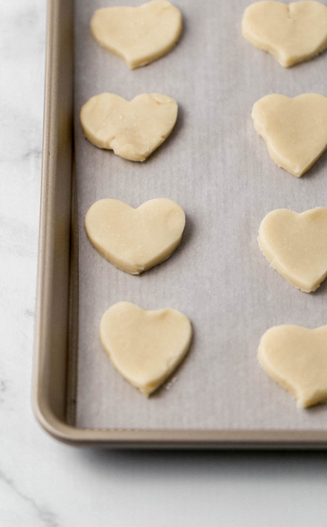 cookies on parchment lined baking sheet before baking 