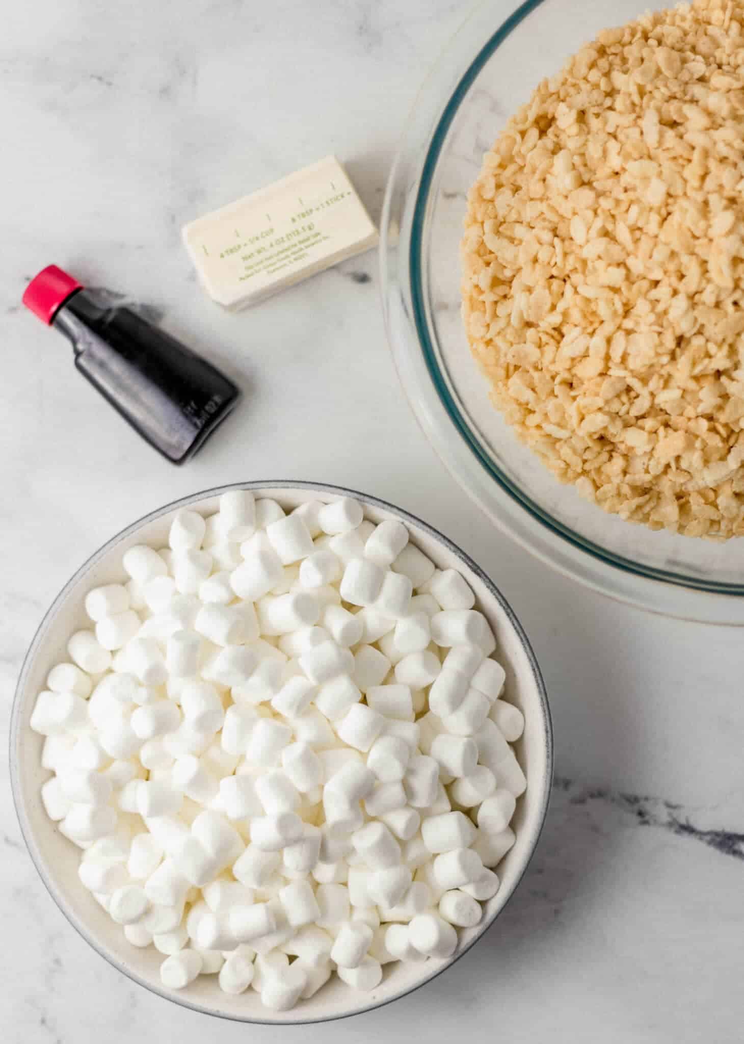 overhead view of ingredients needed to make rice crispy treats in separate bowls and packaging 