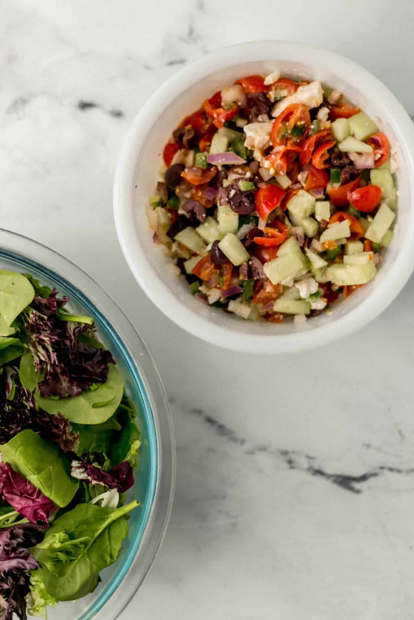 two bowls with ingredients needed to make salad in it