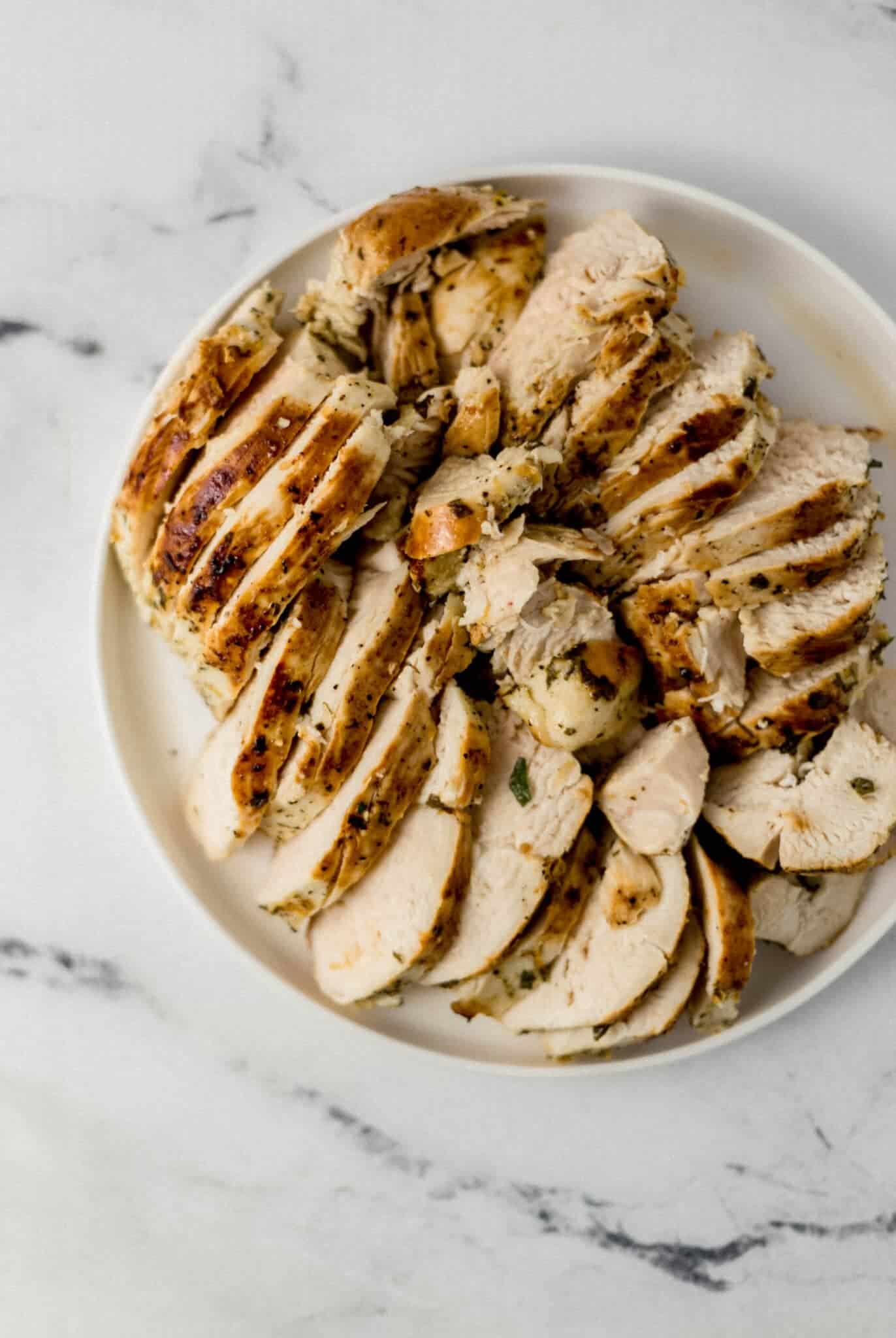 overhead view of finished chicken on large white plate