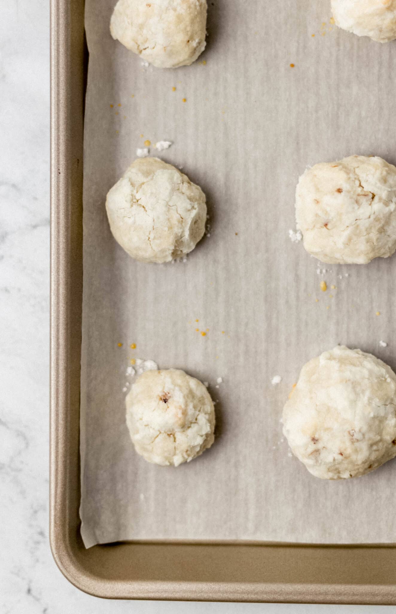 baked cakes on parchment lined baking sheet 