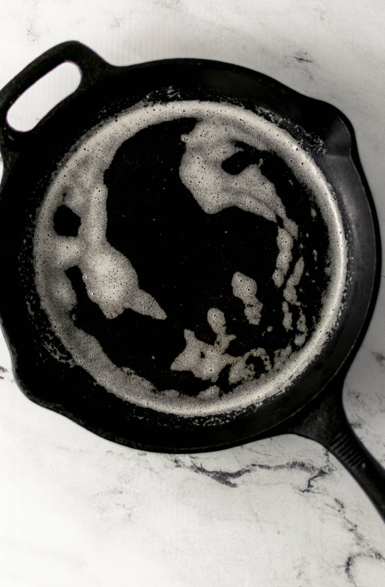 melted butter in a cast iron skillet