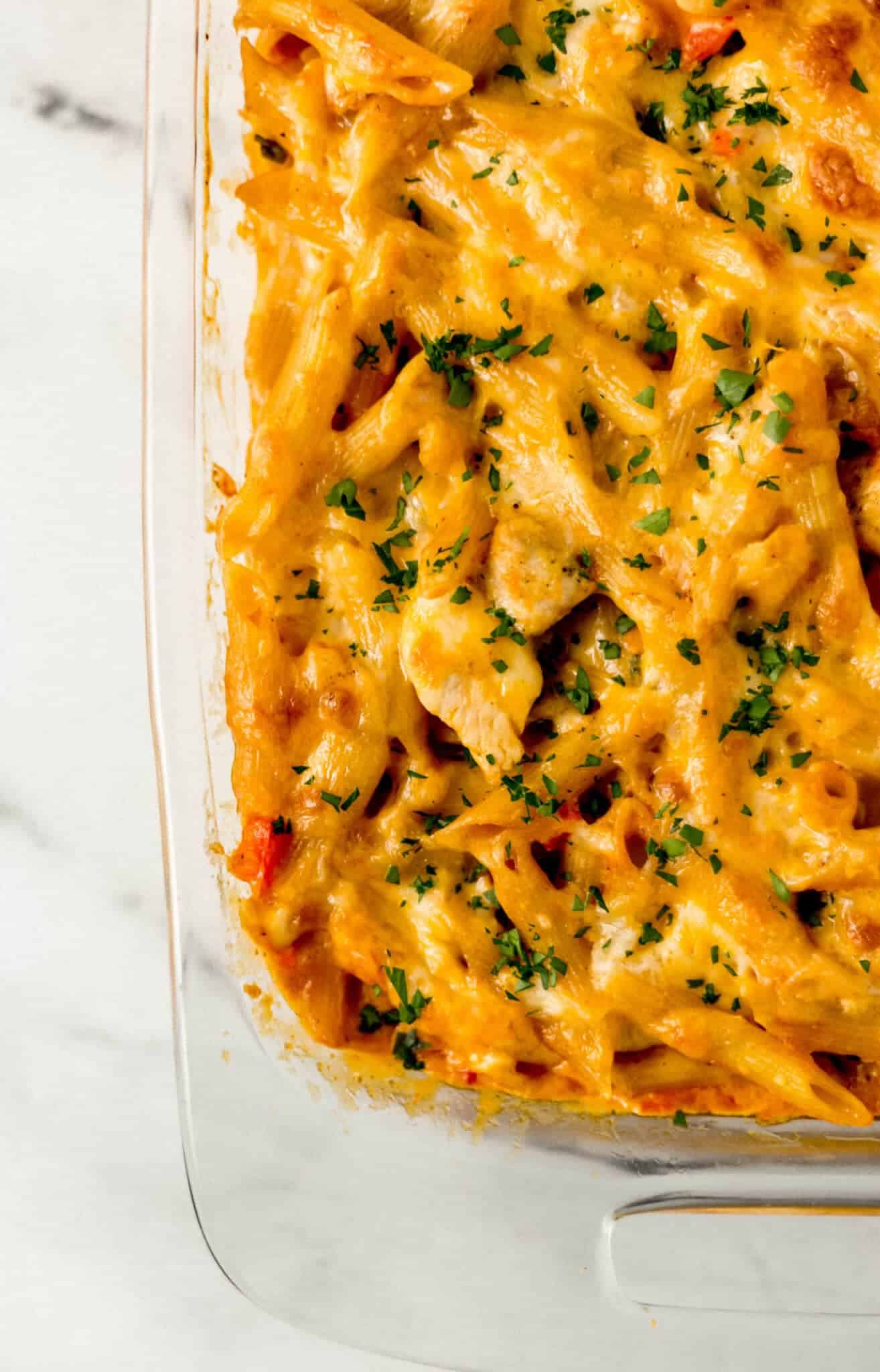 overhead view of baked pasta in rectangle glass baking dish