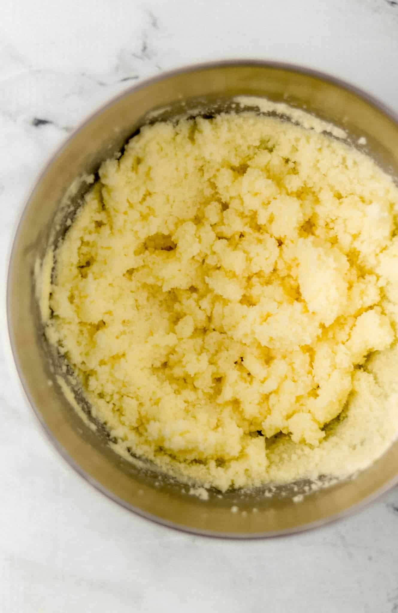 butter and sugar combined in stand mixer bowl 