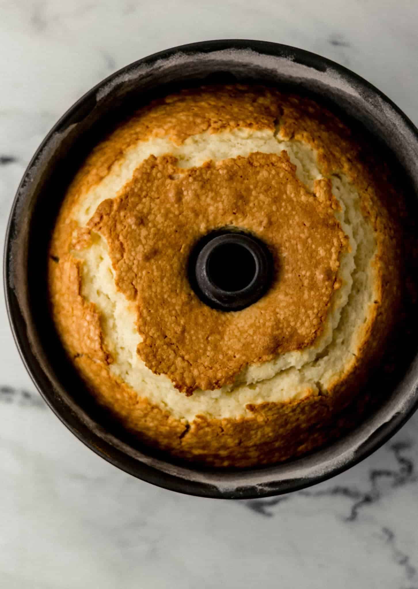 finished pound cake in cake pan on marble surface