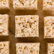 Close up overhead view of square cut treats on parchment paper.