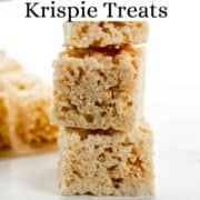 Side view of three krispie treats stacked on each other on pin with text overlay.