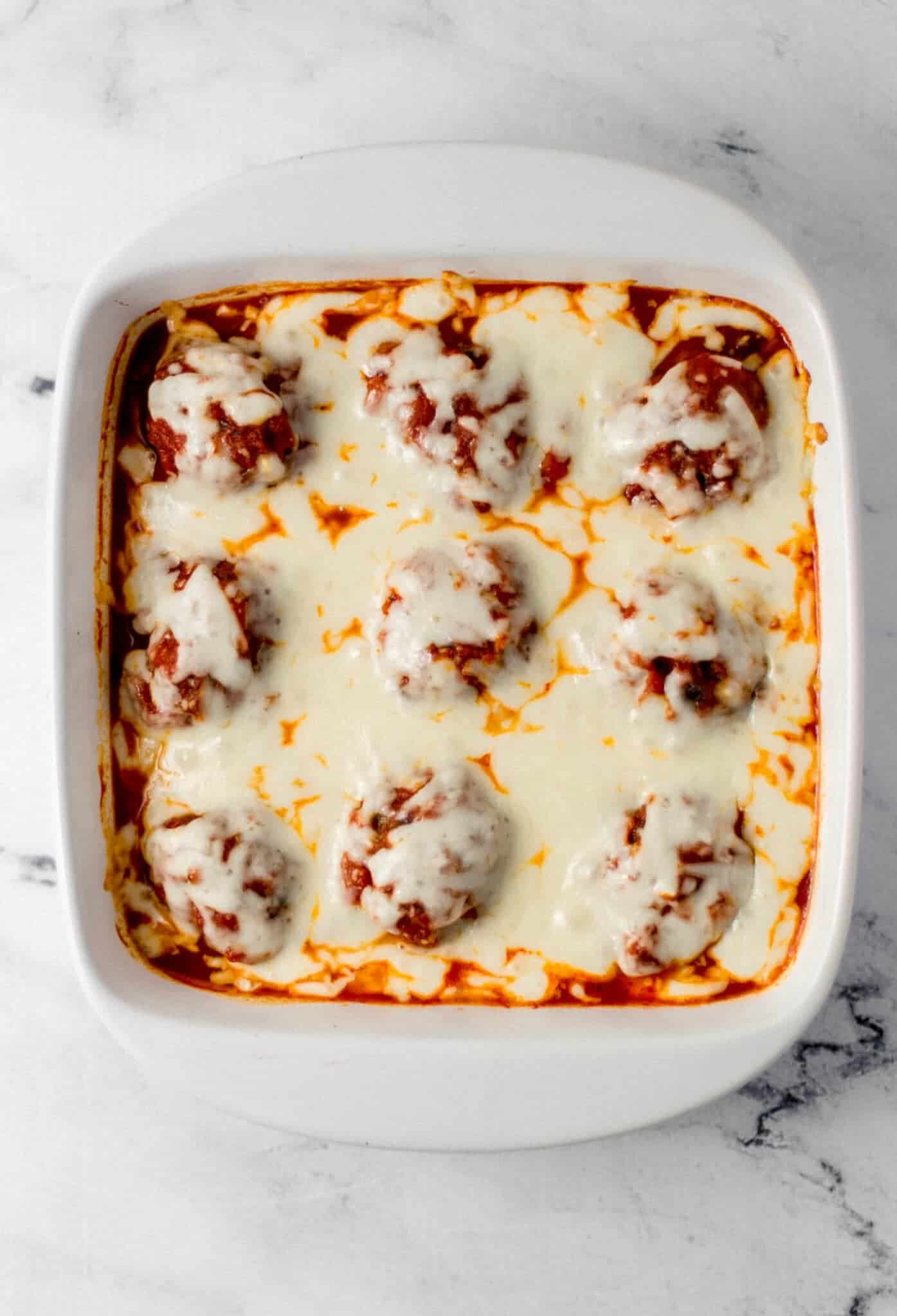 baked casserole in square white baking dish 