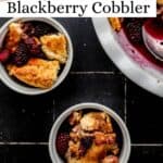 Overhead view of blackberry cobbler in baking dish and two small bowls pin with text overlay.