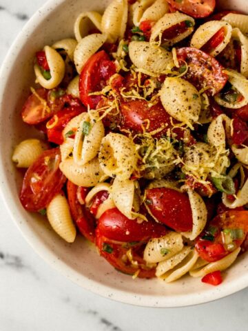 overhead view of serving of finished pasta salad in a white bowl