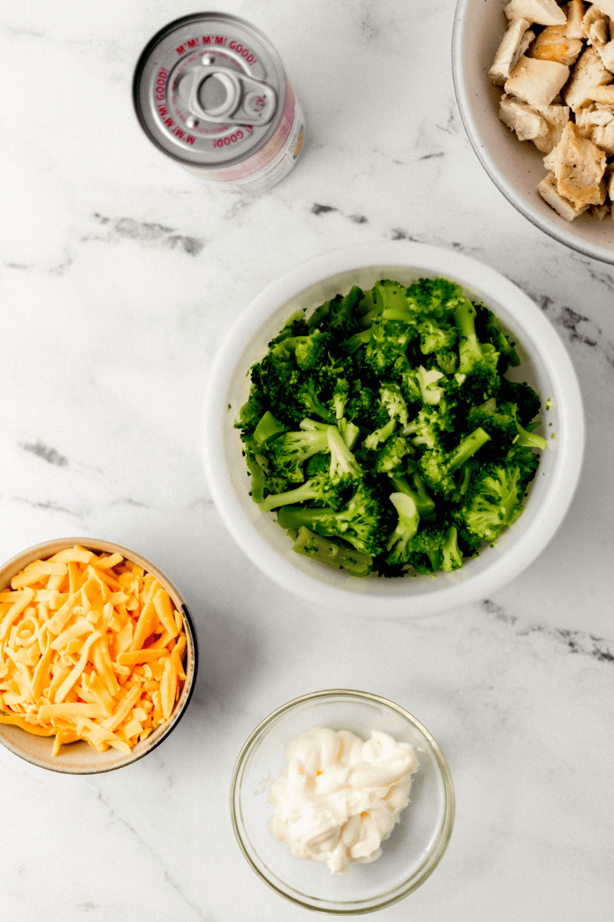 Chicken and Broccoli Casserole Ingredients Simply LaKita overhead view of ingredients needed to make casserole in separate bowls on marble surface
