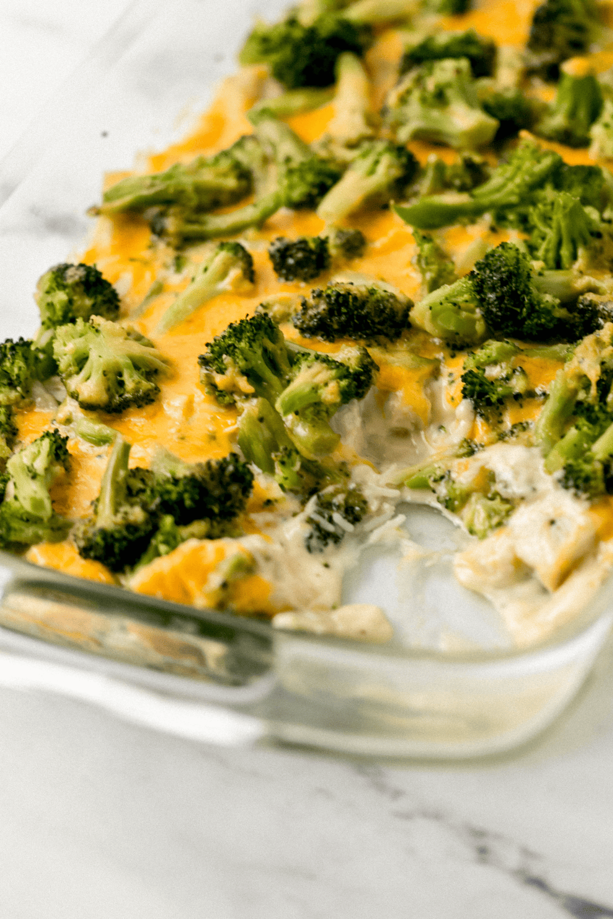 close up view of finished casserole with scoop taken out of it