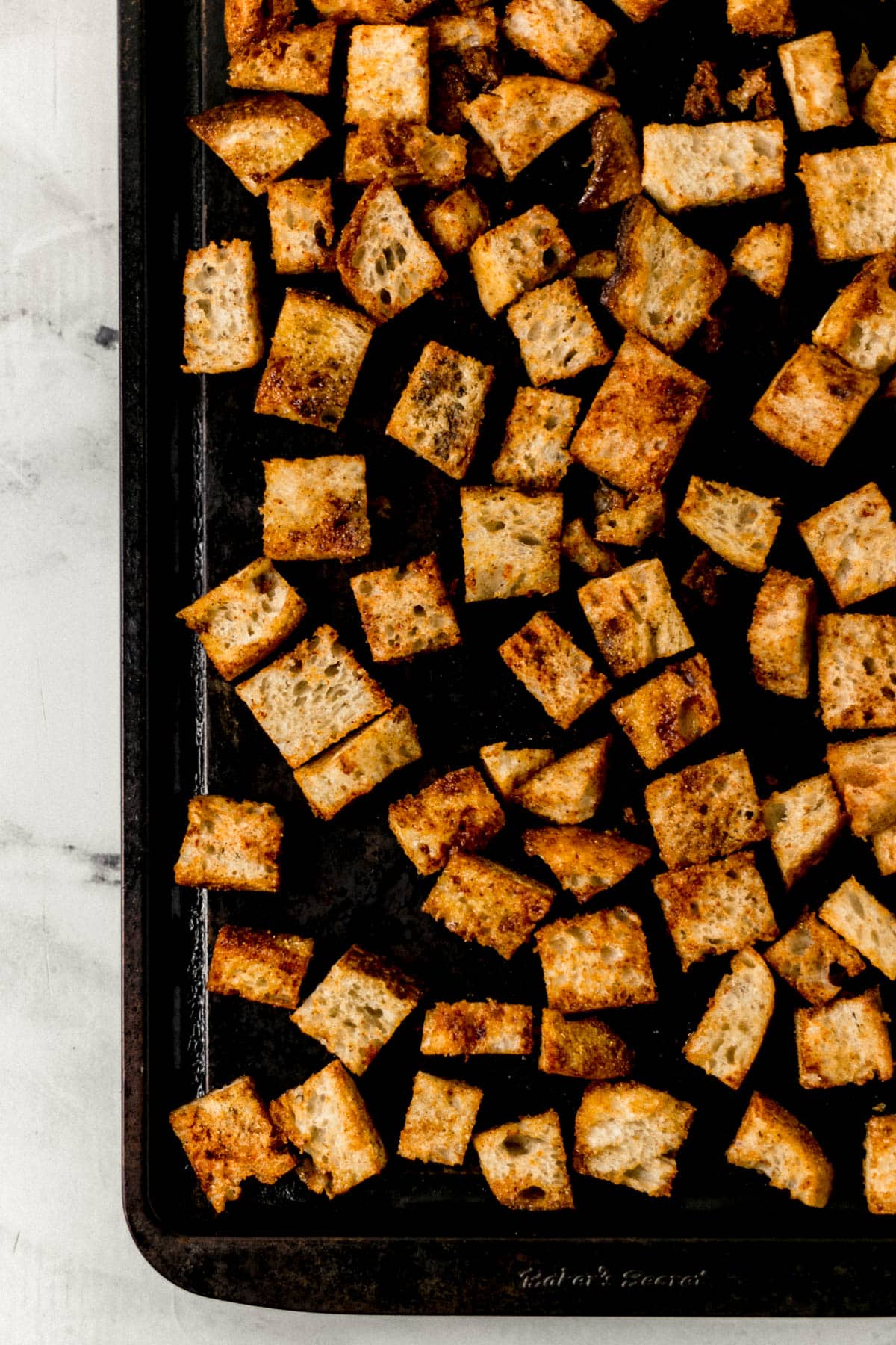 homemade croutons on baking sheet 