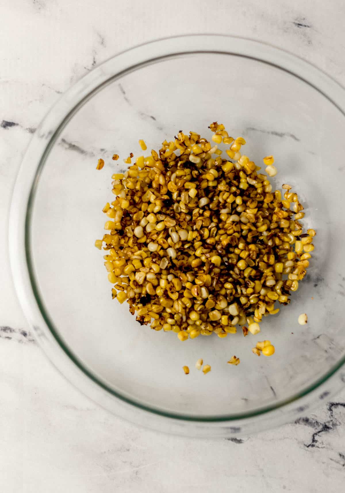 grilled corn in large glass mixing bowl 