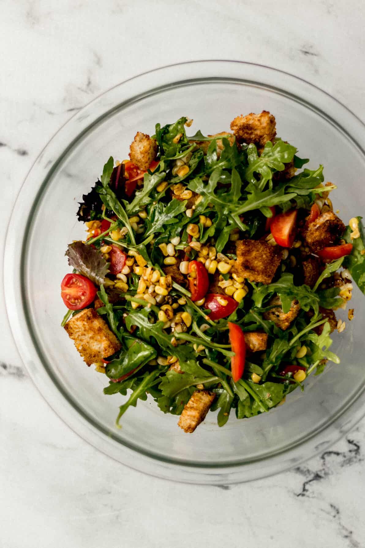 finished salad in large glass bowl 