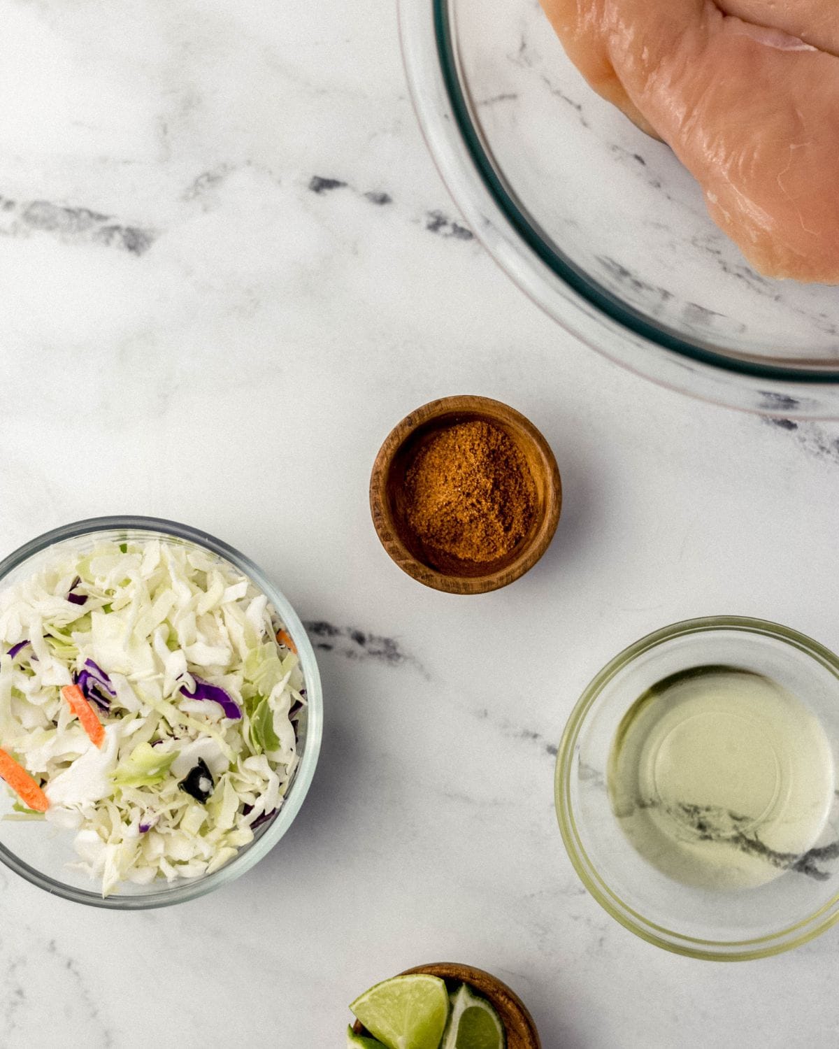 Overhead view of ingredients to make recipe in separate bowls.