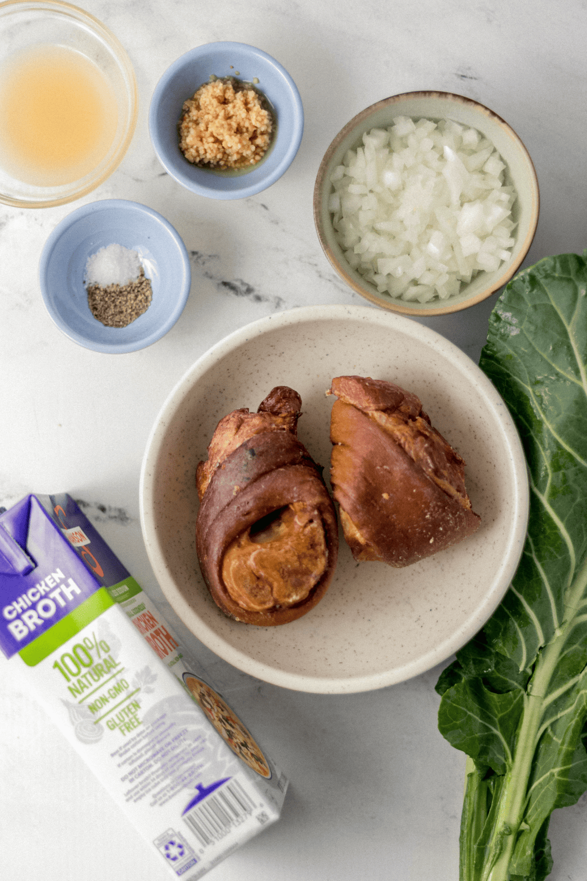 overhead ingredients needed to make green in separate bowls and containers 