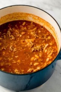 Close up view of finished soup in a dutch oven.