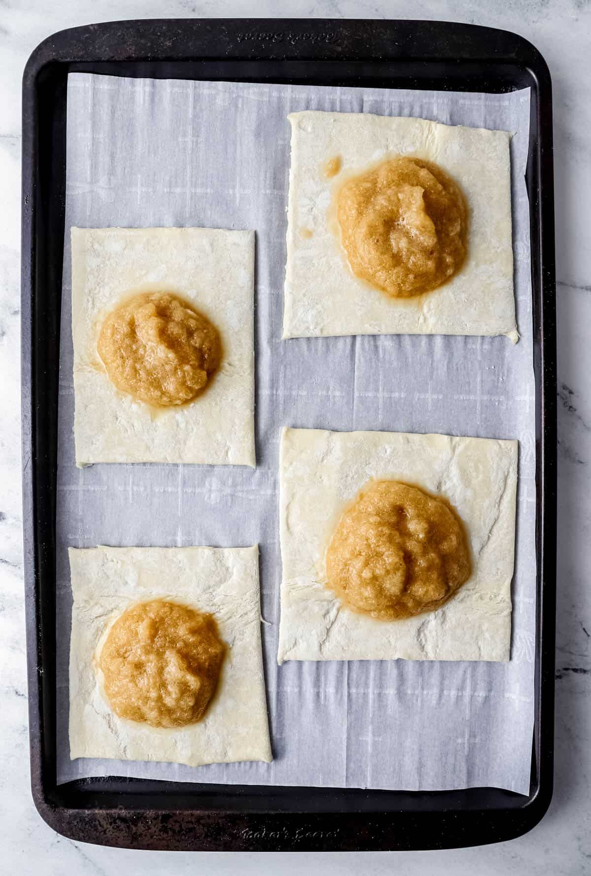 overhead view of puff pasty cut into squares topped with pineapple filling