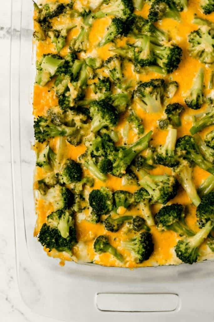 overhead view of finished broccoli casserole in glass baking dish