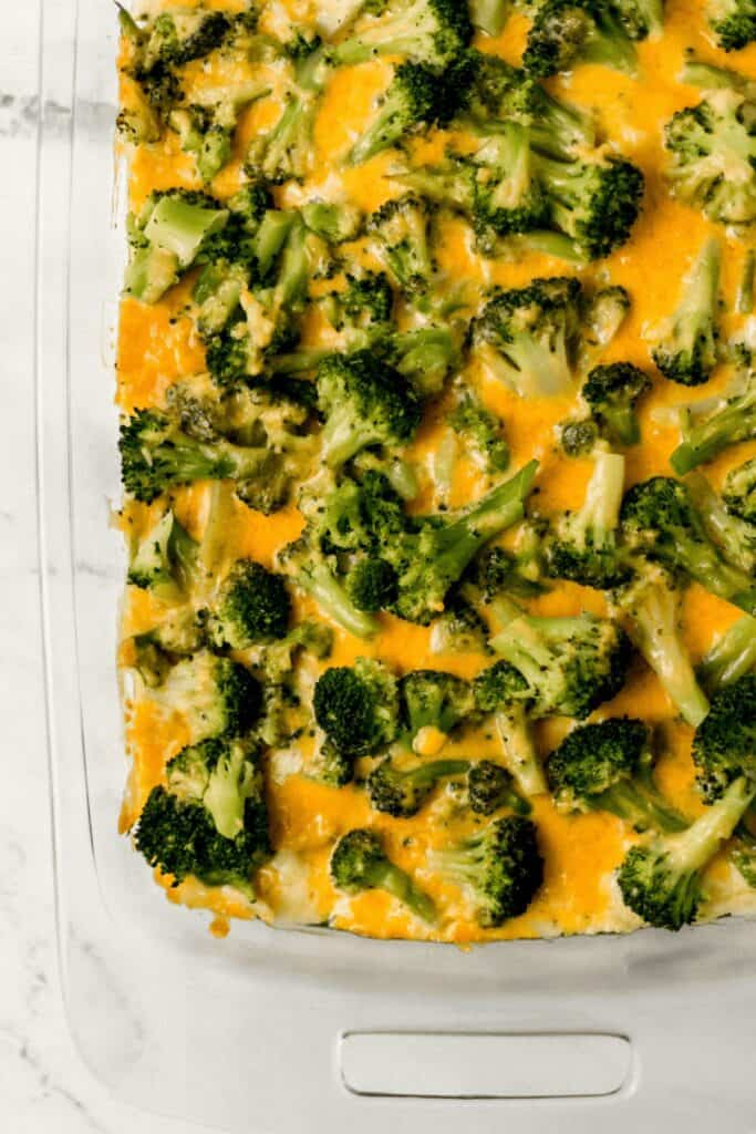 overhead view of finished broccoli casserole in glass baking dish