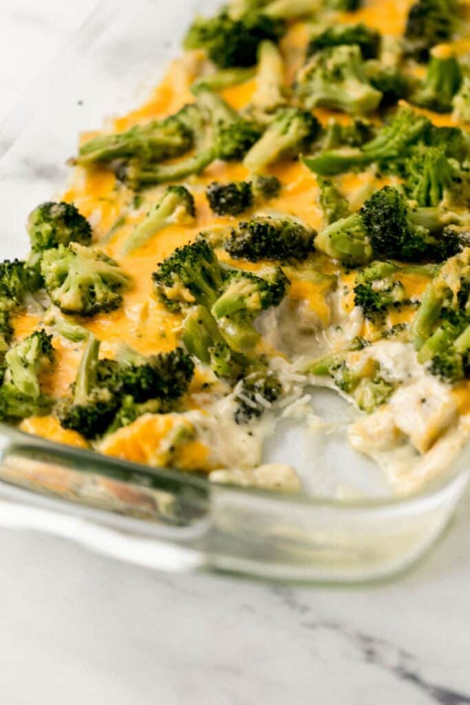 close up view of casserole in glass dish with some taken out of it