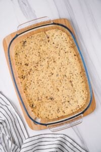 Overhead view of baked crust in glass baking dish.