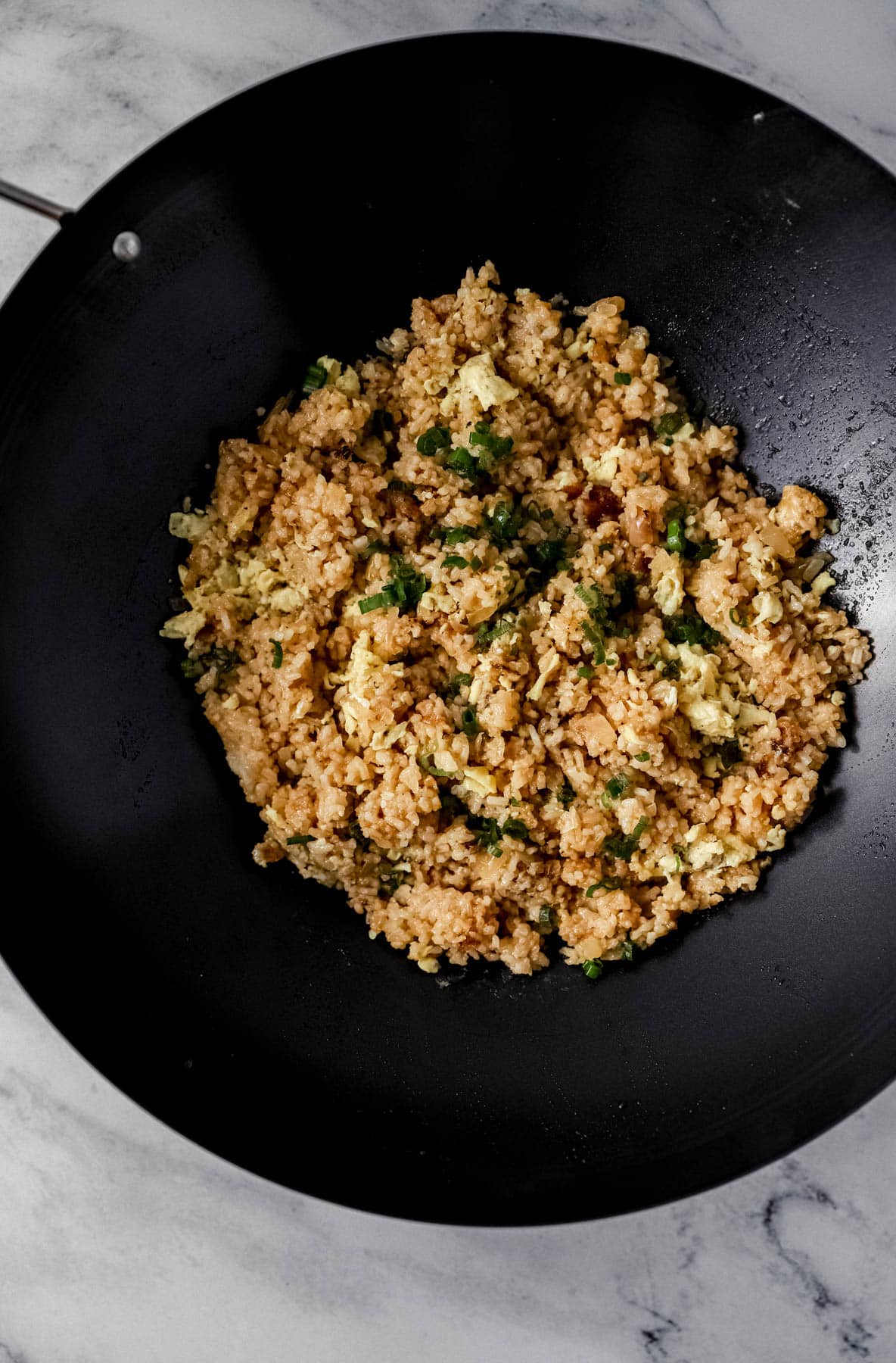 Overhead view of finished hibachi fried rice in wok. 