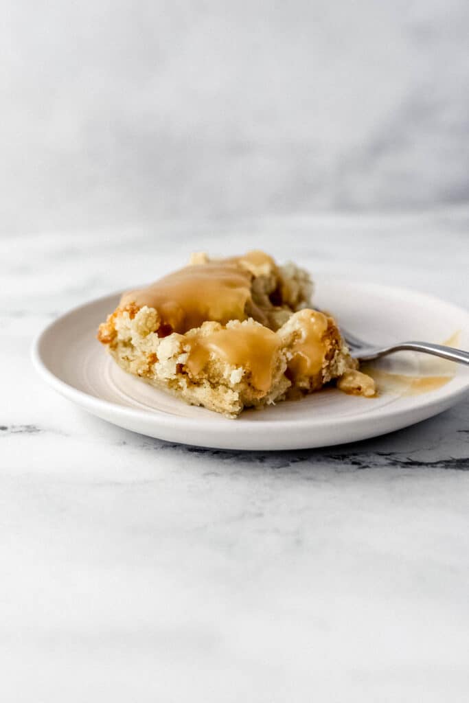 Close sideview of plate of dressing topped with gravy.