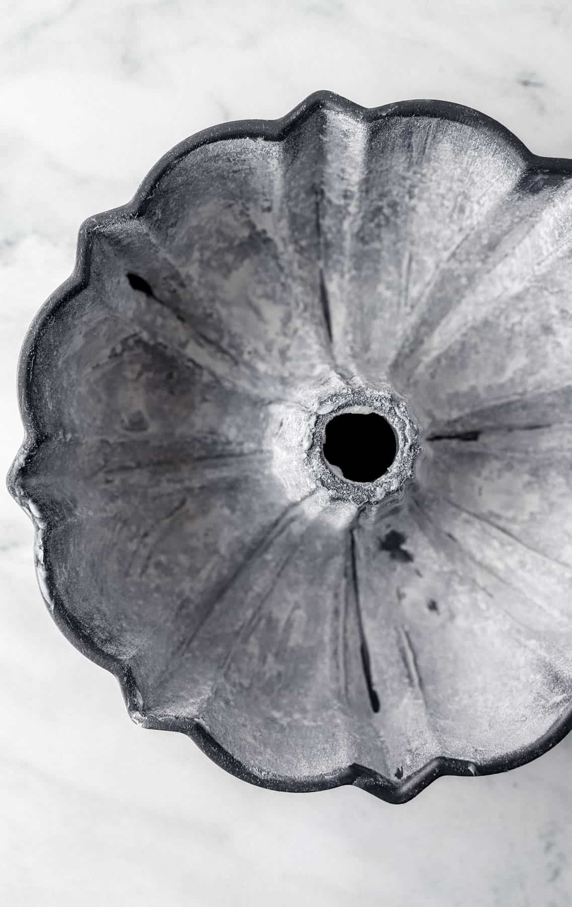 Greased and lightly floured bundt pan.