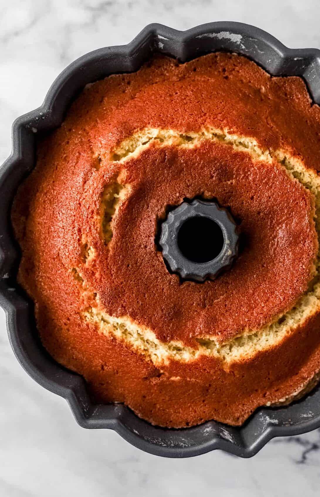 Overhead view of baked cake in pan.