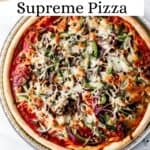 Finished Pizza in pan on marble surface pin with title text overlay