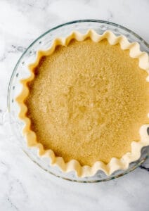 Pie filling added to pie crust before baking.