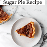 Slice of pie on white plate with the rest in the background on pin with text overlay.