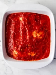 Sauce added over the baked chicken in the dish.