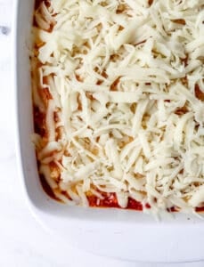 Shredded mozzarella added to the top of the chicken dish.