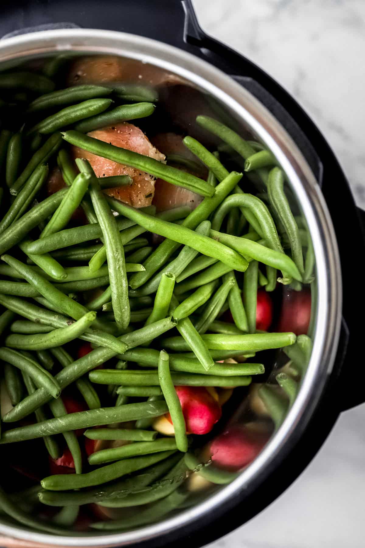 Fresh green beans added to instant pot with the chicken and potatoes. 