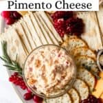 Close up of pimento cheese in glass bowl on snack tray pin with text overlay.