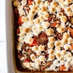 Overhead view of baked sweet potato casserole in white baking dish.