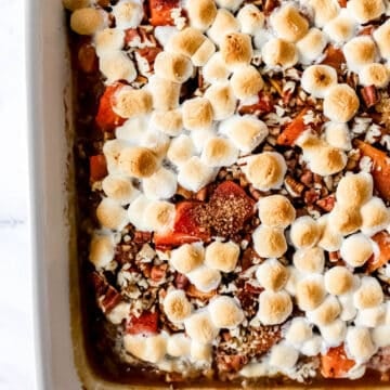 Overhead view of baked sweet potato casserole in white baking dish.
